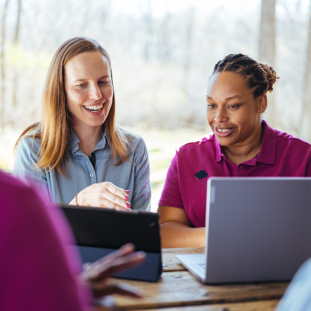 Girl Scout volunteers on laptops