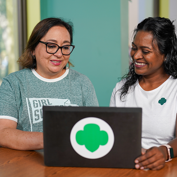Two volunteers on laptop