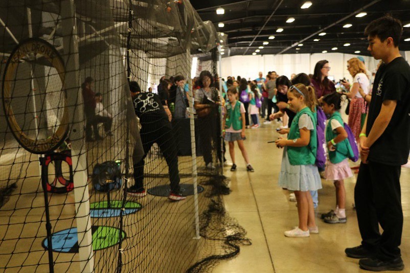 Taking Flight: Girl Scout Juniors practice piloting drones at the Drones4Kids and DronesbyGirls booth.